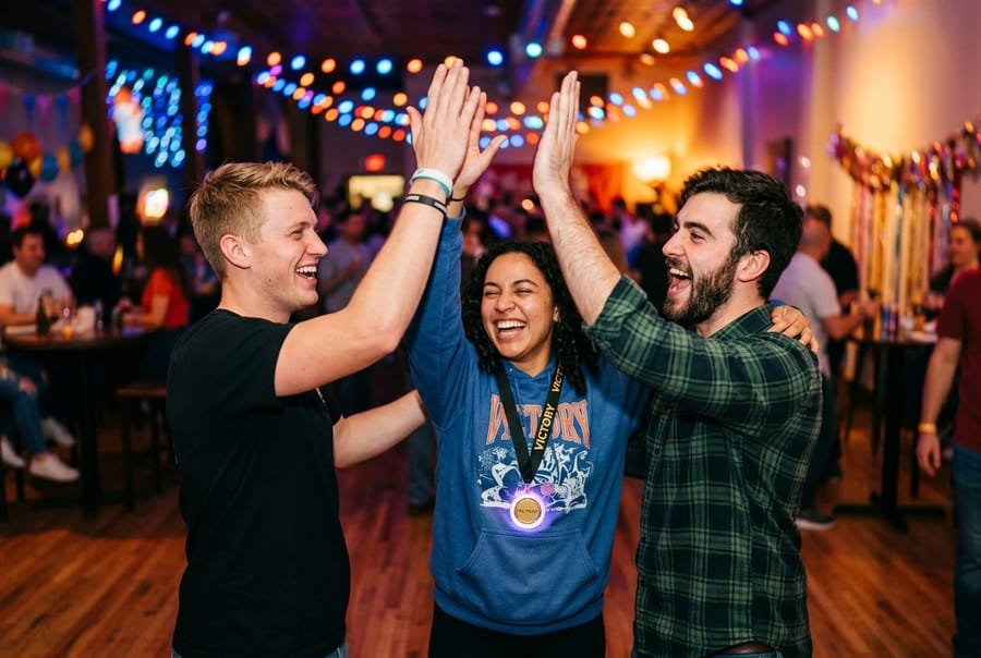 Friends celebrating a win after a round of the Imposter game